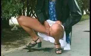 Blonde babe peeing in a public park