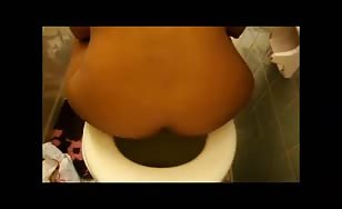 Tanned girl pooping