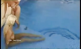 Two blonde girls shitting in a public pool