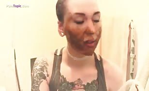 Rubbing shit on her face