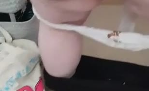 Shitting in blue shorts
