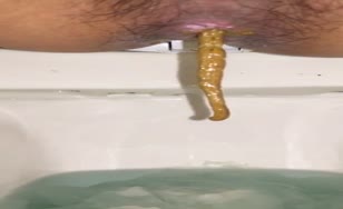 Long yellow shit in toilet