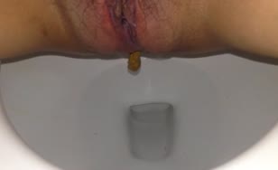 Close up of shaved babe pooping