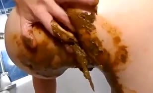 Using a huge dildo to masturbate