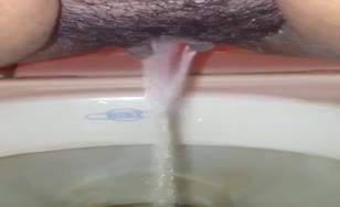 Hairy babe shitting and peeing