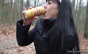 Dark haired beauty shitting in a forest