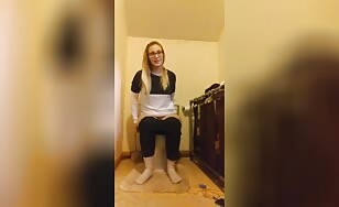 Nerdy blonde shits in toilet