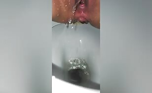 Closeup of pissing pussy and pooping ass 
