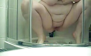 Chubby busty lady poops in the toilet 