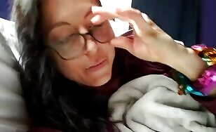 Nerdy brunette girl teasing and pissing in the bed 