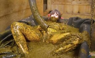 Nasty babe masturbates in the cowshit 