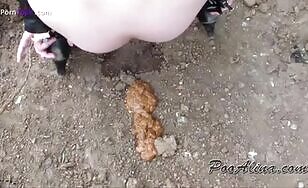 Nice girl getting ready for scat show in the woods