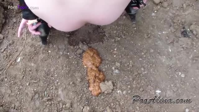 Nice girl getting ready for scat show in the woods