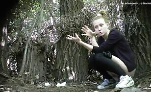 Cute chick drops messy load in the woods 