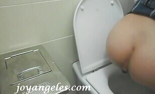 Elena takes a shit in a public toilet 